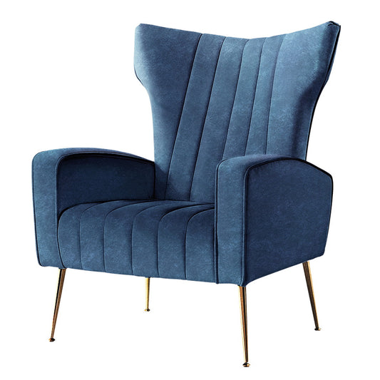Navy velvet armchair with retro wingback design, vertical channel tufting, and slim gold metal legs, vintage-inspired home.