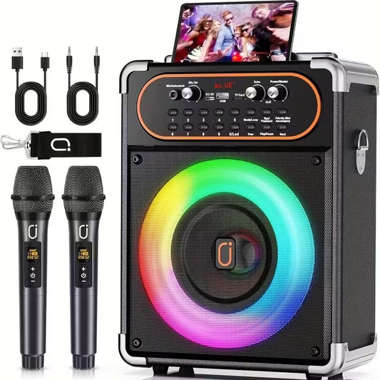 Wireless karaoke machine with dual black microphones, colorful LED speaker ring, and tablet holder, sleek black and silver.