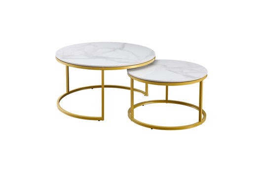 Nesting coffee tables set with white marble tops and champagne gold metal frames, retro vintage style for home decor.
