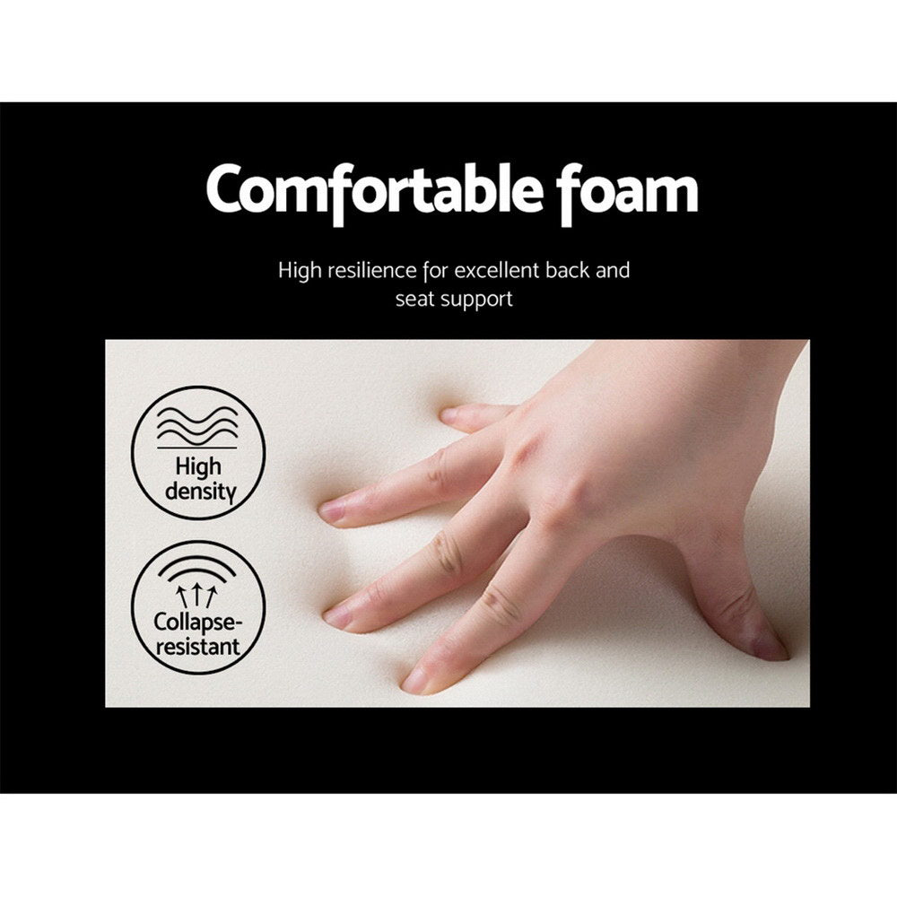Hand pressing soft, high-density foam cushion highlighting comfort and collapse resistance for vintage home decor seating.