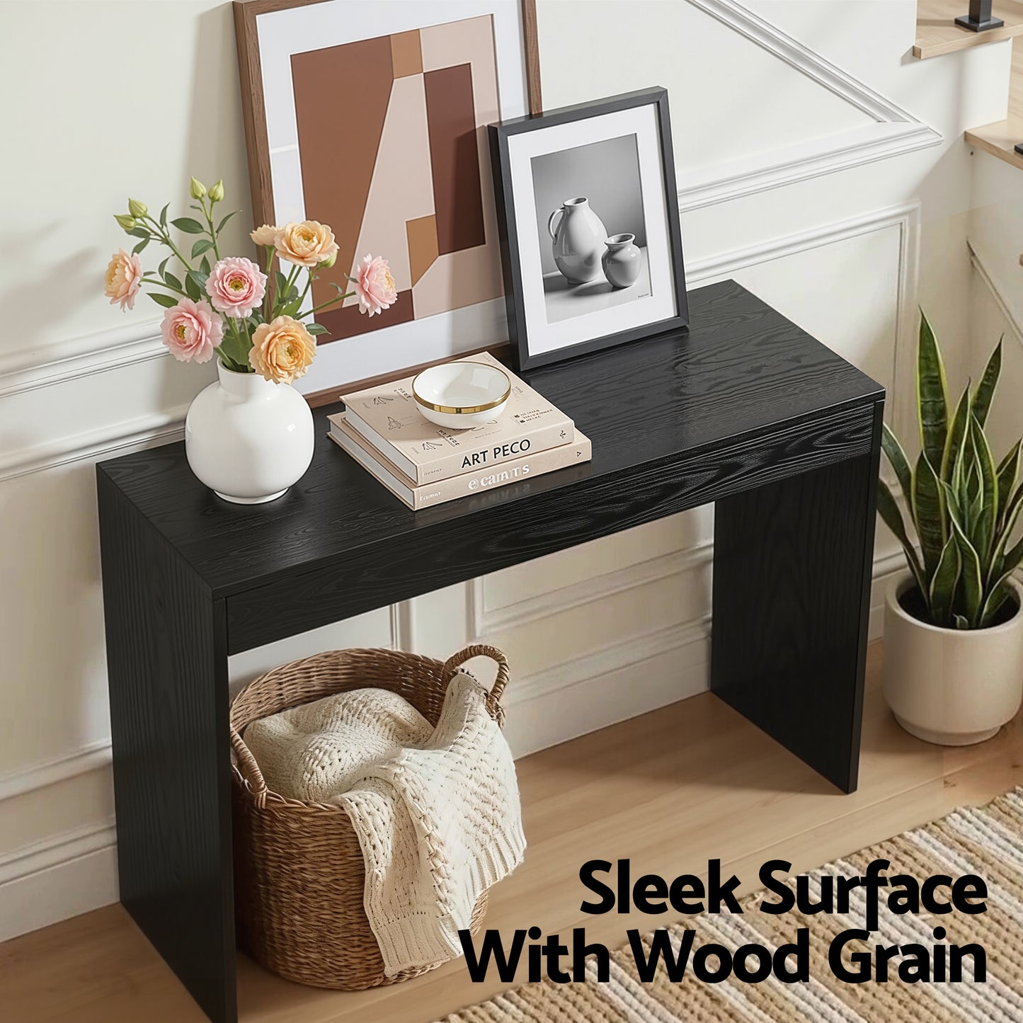 Black wooden console table with decorative items in a room setting