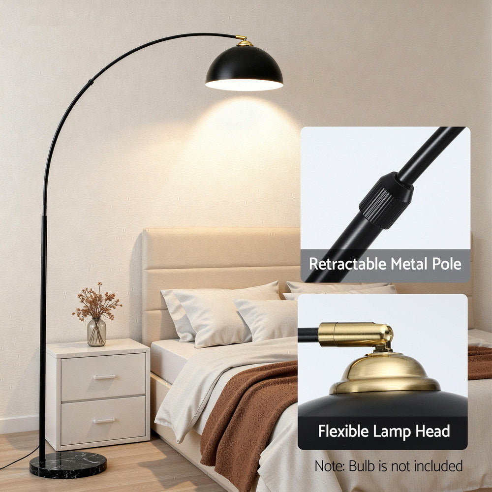 Black arched floor lamp with heavy-duty marble base and flexible metal pole, retro velvet lampshade illuminating beige.