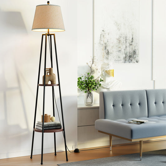 Retro velvet gray floor lamp with two-tier black metal shelves, standing beside mid-century modern sofa in bright living.