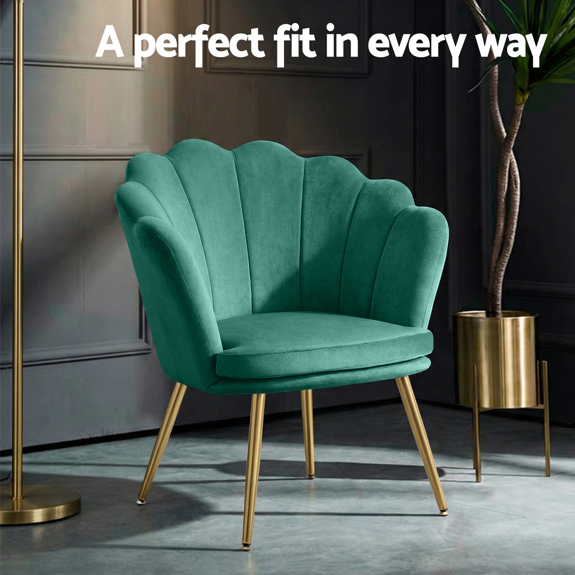 Green velvet retro armchair with scalloped backrest and gold metal legs in stylish home decor setting with dark paneled wall .
