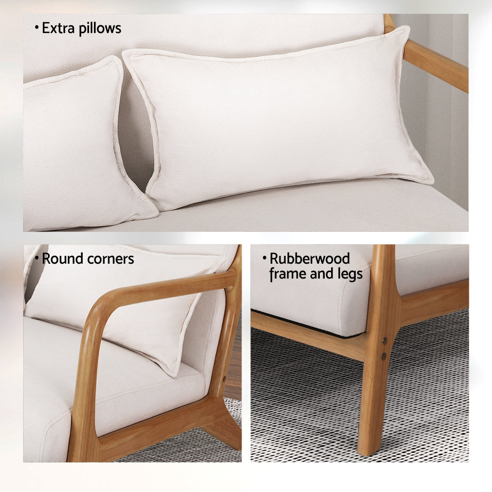 Beige velvet retro lounge chair with rounded wooden armrests and legs, showing extra cushions and rubberwood frame details.