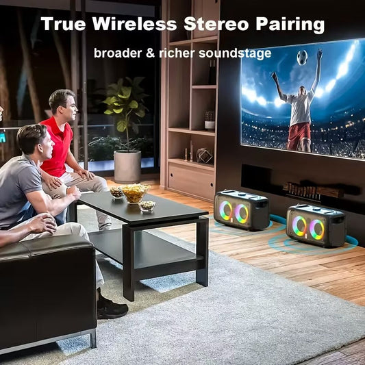 Retro portable karaoke speakers with glowing multicolor rings and two wireless microphones, set on a wooden floor in a cozy.
