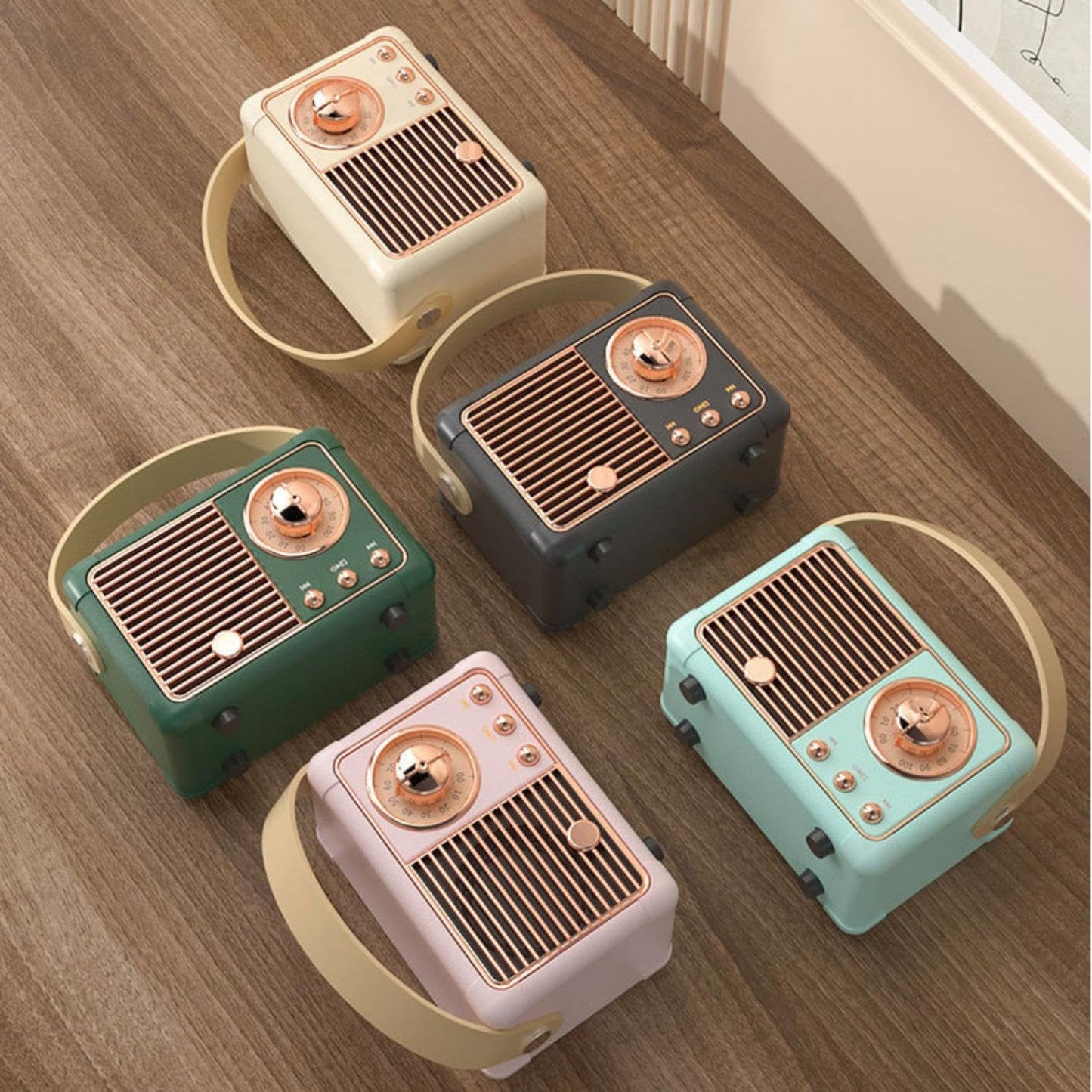 Set of five vintage-style radios on a wooden floor