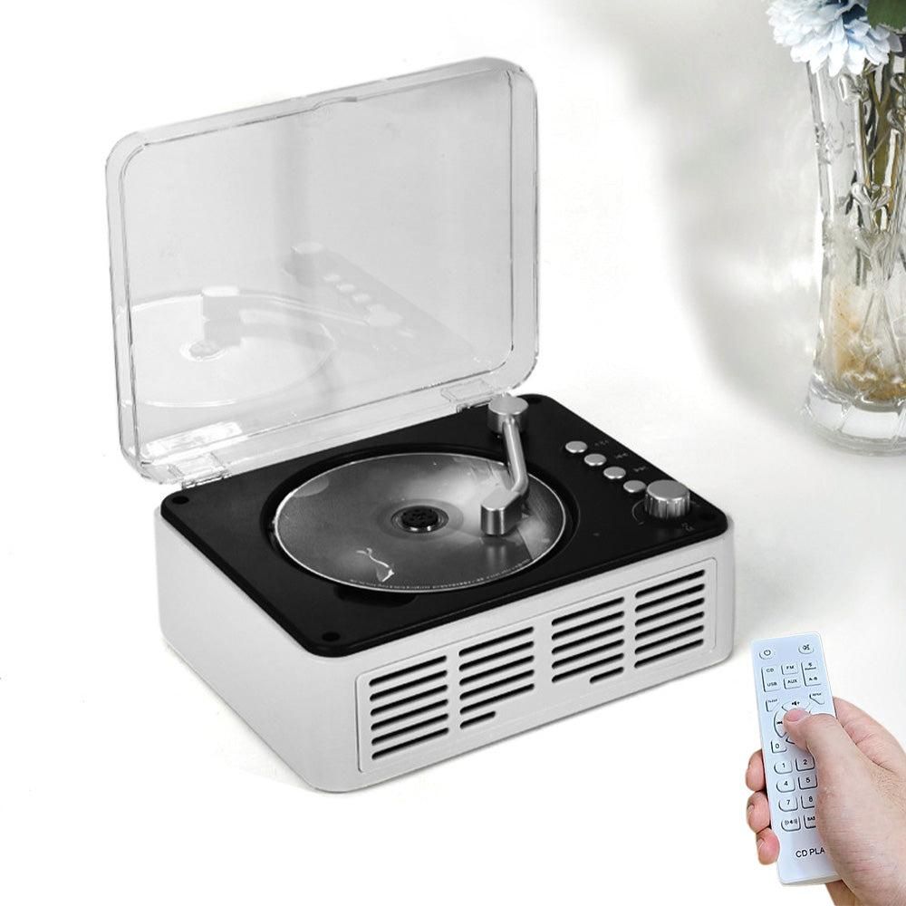 Vintage-style record player with a remote control on a white background