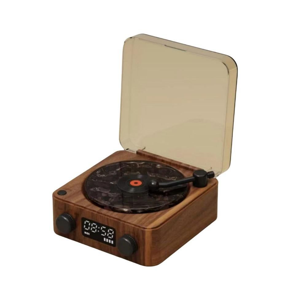 Wooden record player with a beige top cover on a white background