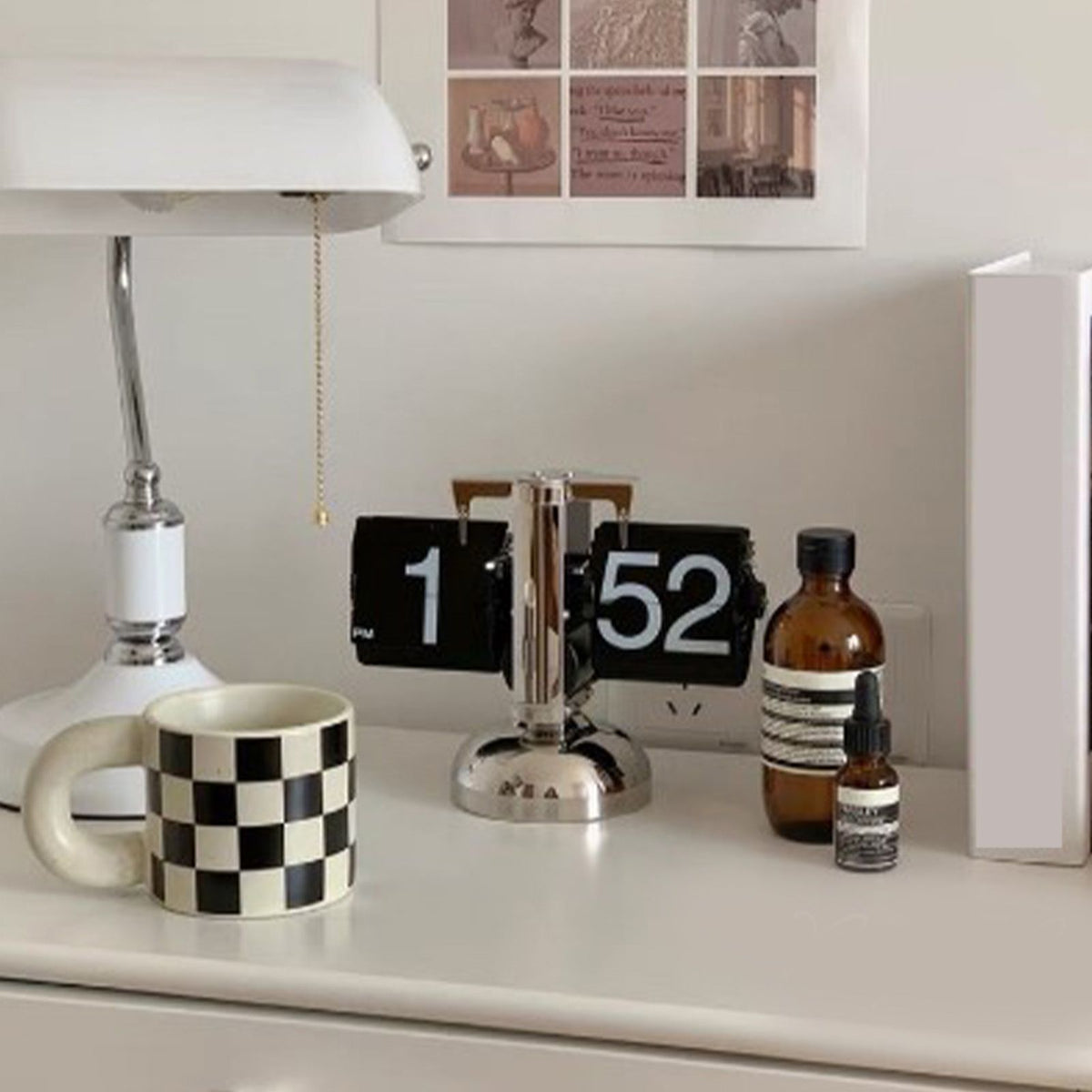 Desk with a mug, clock, and bottles in a home office setting