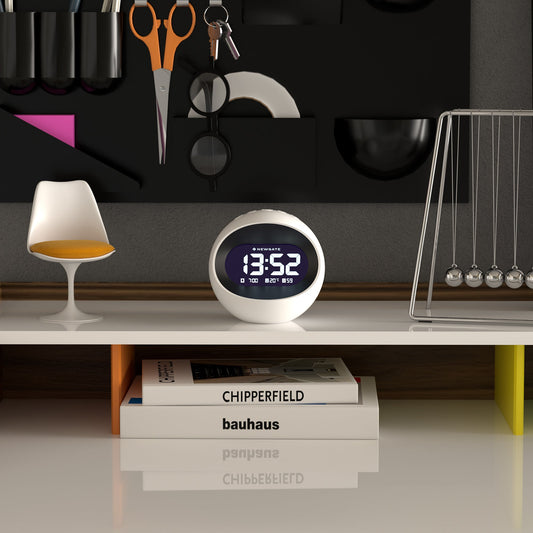 White Newgate Centre Of The Earth LCD alarm clock with retro design on white shelf, surrounded by modern home decor.